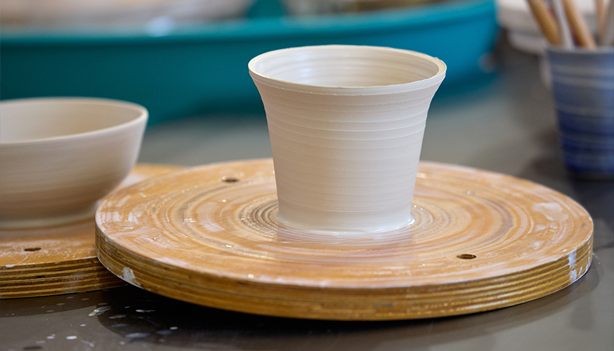 Pottery displayed on pottery wheel